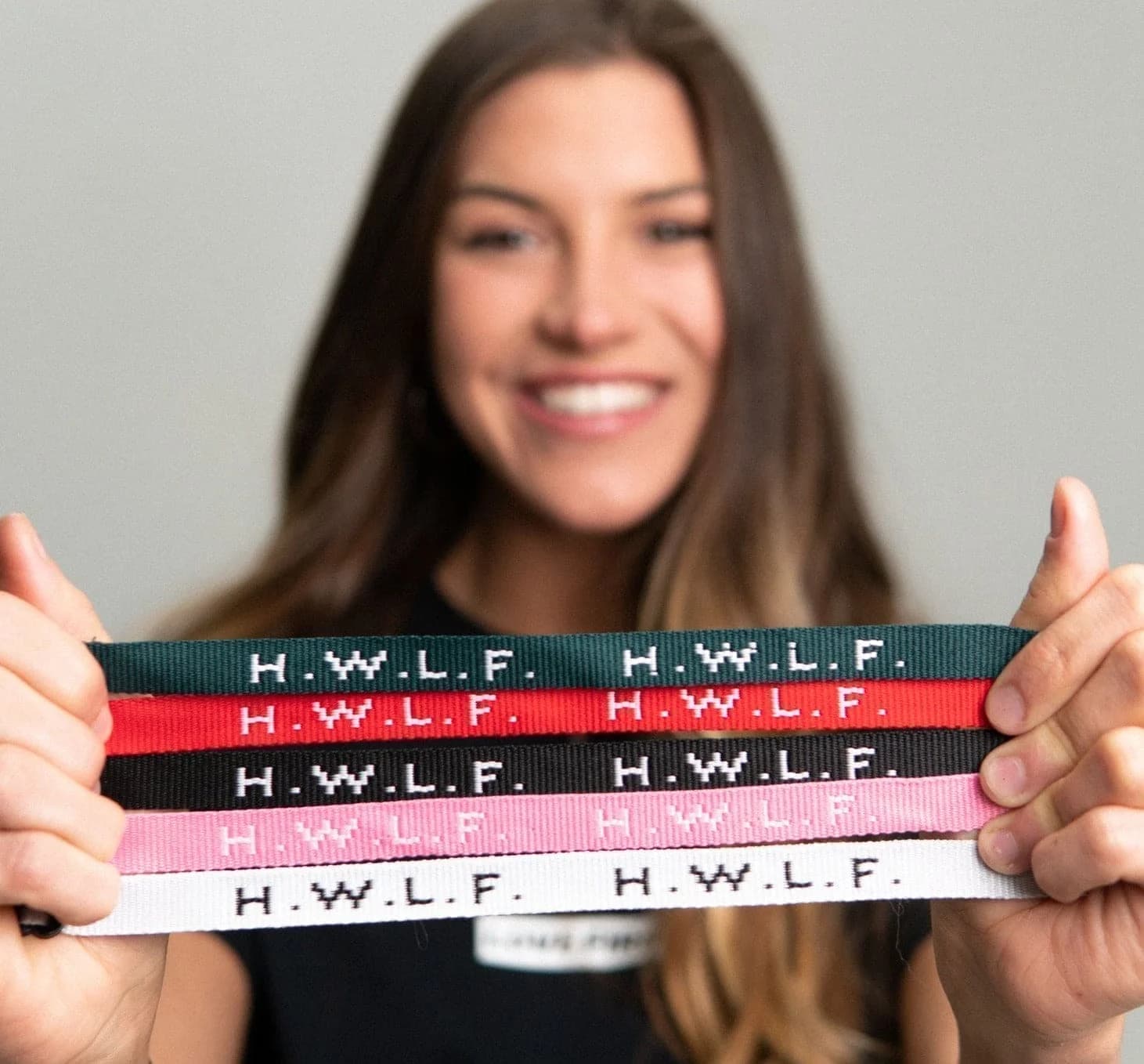 Customer holding HWLF woven bracelets